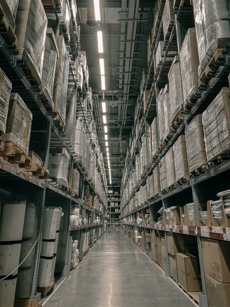 Warehouse racking aisle with palletised stock ready for freight